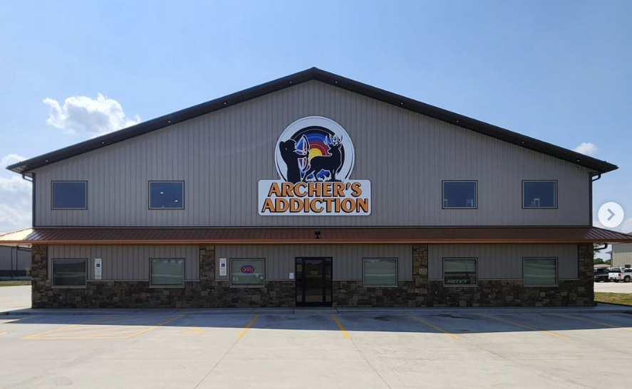 Archer's Addiction facility exterior — large gray building with orange logo badge
